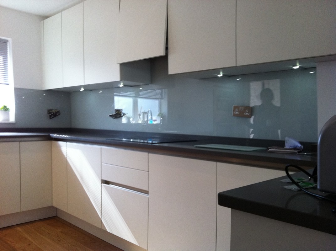 Grey glass kitchen splashback with LED lighting in Isleworth