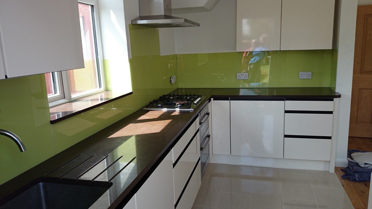 Lime green glass kitchen splashback installed by Isleworth glaziers