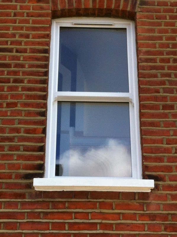 uPVC sash window on Victorian red brick house in Isleworth